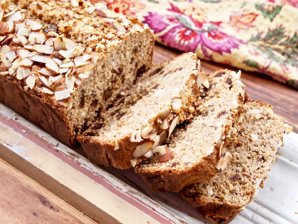 Vanilla Almond Bread with Dates and Goat Cheese | Sweet fruits and aromatic vanilla lend their flavors to this incredible  bread! Savory goat cheese adds delicious creaminess, sliced almonds add the perfect amount of crunch, and candy-like dates are spread throughout every slice. Whole-grain and naturally sweetened this unique loaf only TASTES rich and indulgent!