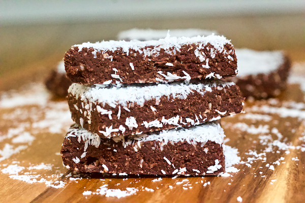 Chocolate Banana Coconut Fudge Bars | Chocolate, banana, and coconut come together in these deliciously decadent fudge bars. These no-bake treats are easy to make, naturally vegan, gluten-free, and have no added sugar. A perfect dessert or healthy, sweet snack!