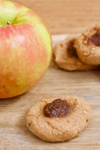 Apple Pie Thumbprint Cookies | Soft, doughy thumbprint cookies with a heavenly apple cinnamon scent and taste! Vegan, gluten-free, and only sweetened with fruit. These cookies are like bite-sized apple pies! 