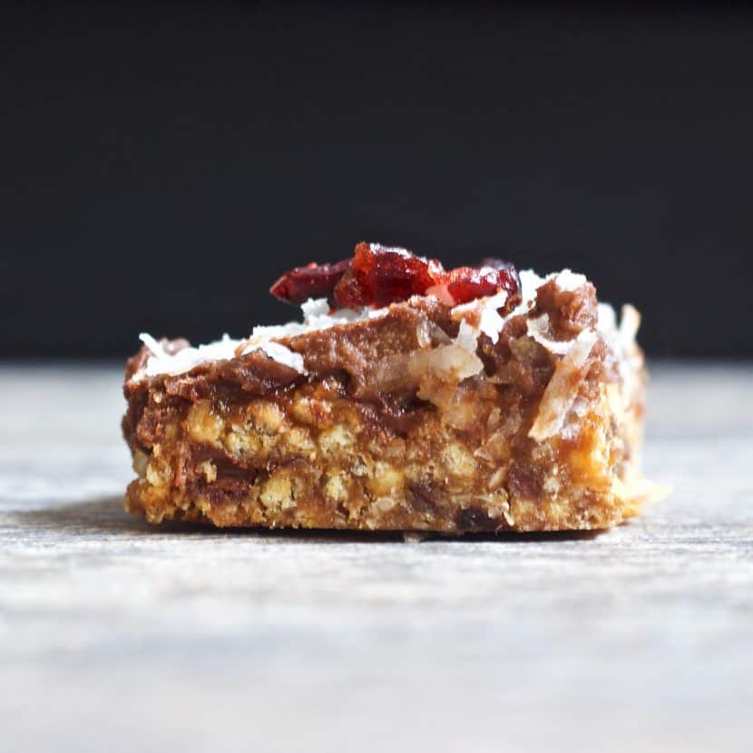 Layered Peanut Chocolate Cherry Brownie Bars | Healthy Helper @Healthy_Helper Deliciously decadent layered brownie bars with rich chocolate, tart cherries, and creamy peanut flavor throughout! Gluten-free, vegan, and only 5 ingredients. These bars are super easy to make and perfect for sharing with friends! 