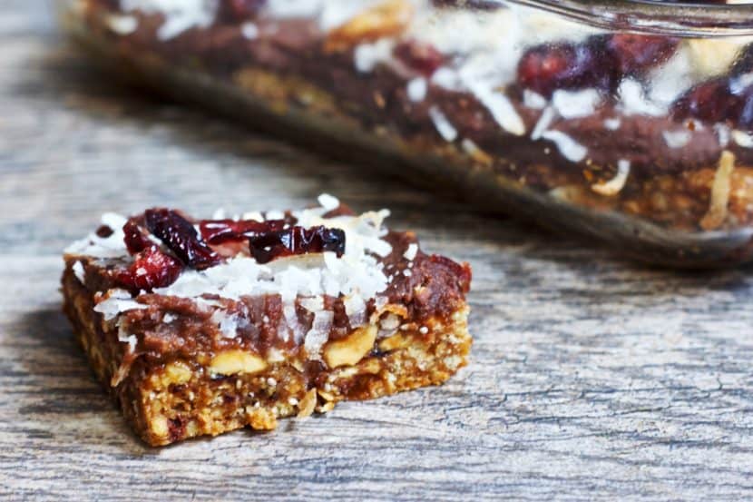 Layered Peanut Chocolate Cherry Brownie Bars | Healthy Helper @Healthy_Helper Deliciously decadent layered brownie bars with rich chocolate, tart cherries, and creamy peanut flavor throughout! Gluten-free, vegan, and only 5 ingredients. These bars are super easy to make and perfect for sharing with friends!