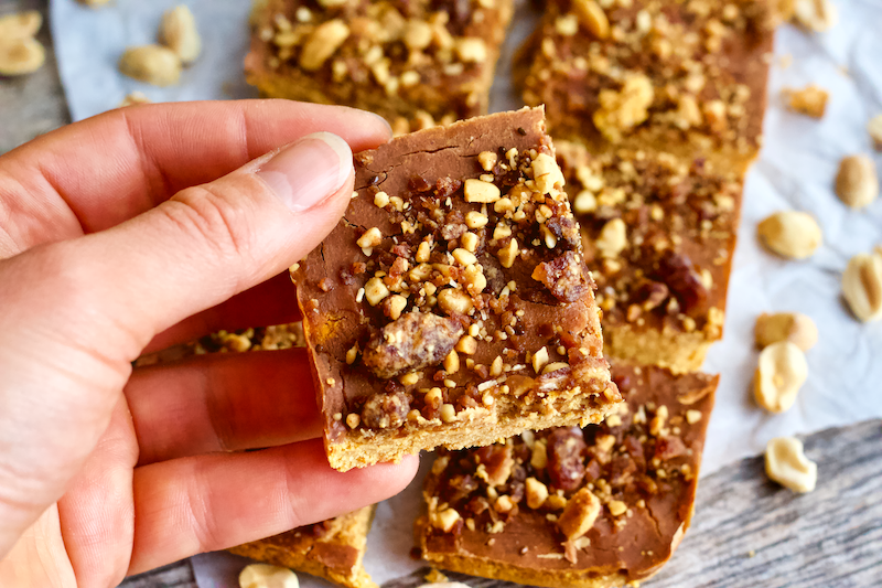 Peanut Butter and Jelly Protein Fudge Bars | Soft, dense, peanut buttery fudge filled with the subtle sweetness of strawberry flavor. The classic combination of peanut butter and jelly comes together in these deliciously healthy protein fudge bars! Vegan, gluten-free, grain-free, and only 5 ingredients.