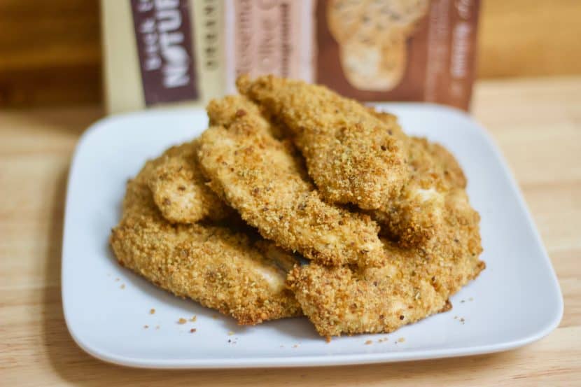 Rosemary & Olive Oil Cracker Crusted Chicken Fingers | Healthy Helper @Healthy_Helper A grownup, healthy version of your favorite childhood meal! These baked chicken fingers are full of flavor from the rosemary, stoneground wheat crackers, olive oil, and cheese blend they are coated with. Crispy on the outside, moist on the inside, and totally delicious!