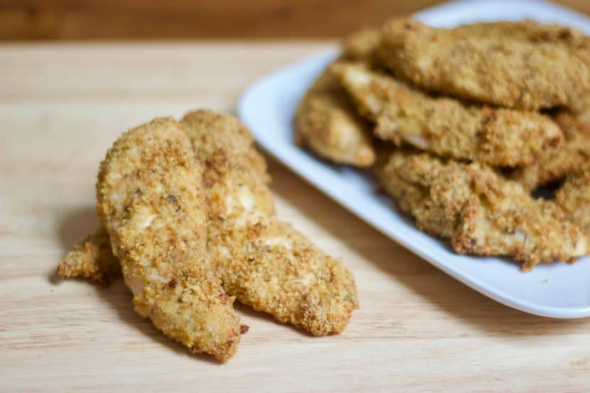 Rosemary & Olive Oil Cracker Crusted Chicken Fingers | Healthy Helper @Healthy_Helper A grownup, healthy version of your favorite childhood meal! These baked chicken fingers are full of flavor from the rosemary, stoneground wheat crackers, olive oil, and cheese blend they are coated with. Crispy on the outside, moist on the inside, and totally delicious!