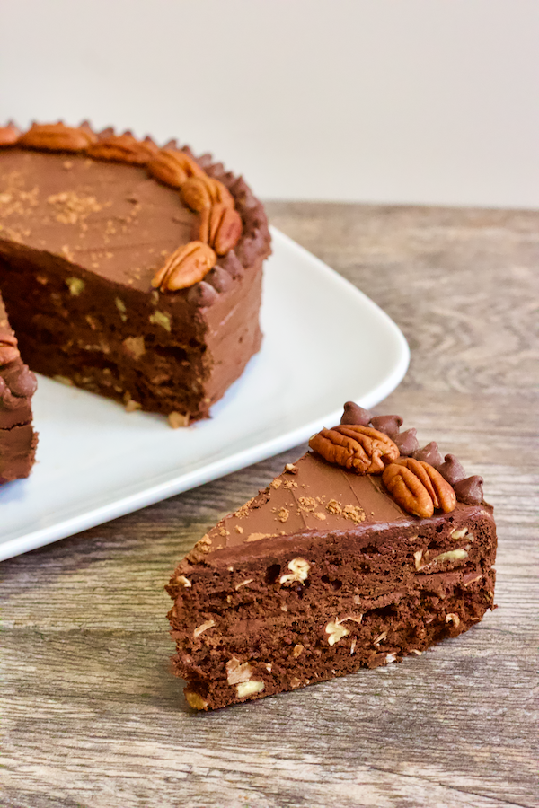 Vegan Gluten-Free German Chocolate Cake | The ultimate healthy chocolate cake that tastes like a traditional German Chocolate Cake. Vegan, gluten-free, and no added sugar, this dessert will be a hit with the whole family whether they're vegan or not. It's also oil-free and filled with nutty goodness!