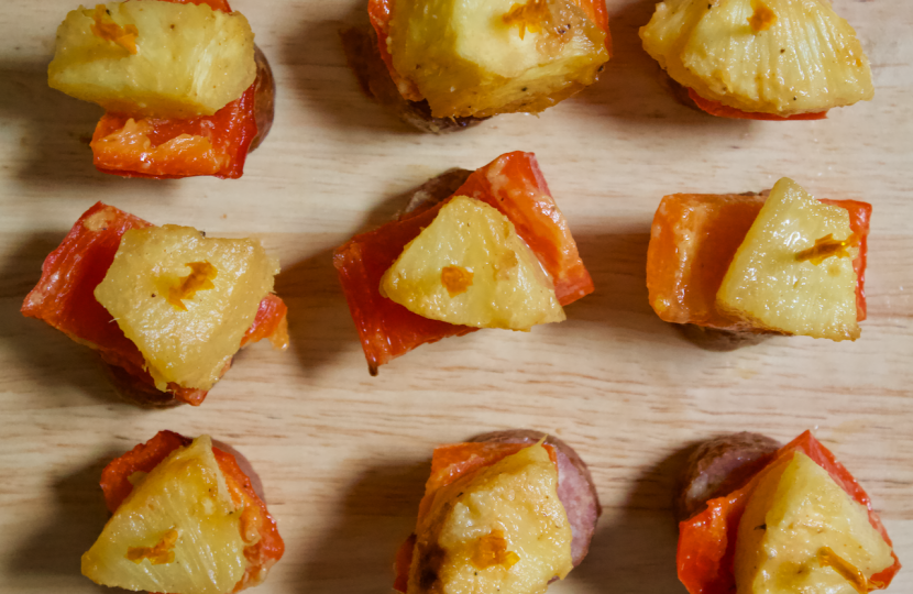 Sausage, Pepper, and Pineapple Skewers | Perfectly portioned, sweet and savory sausage kabobs paired with fresh red peppers and pineapple. Baked with a tangy Dijon-maple sauce, these mini-kabobs are a meaty mouthful that everyone will love to munch at your next get-together.