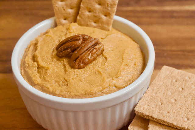 Carrot Cake Dessert Hummus | Perfectly spiced Carrot Cake dessert hummus that tastes like a fresh from the oven baked good! Creamy, smooth, and just sweet enough to satisfy all your cake cravings.  Vegan, gluten-free, and low in sugar.