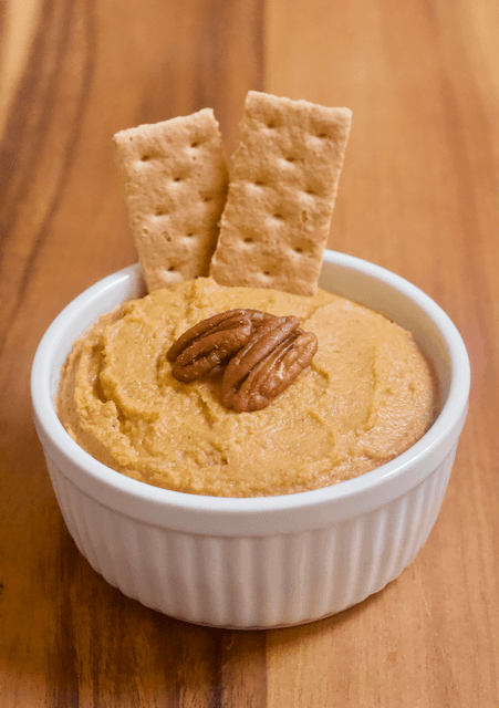 Carrot Cake Dessert Hummus | Perfectly spiced Carrot Cake dessert hummus that tastes like a fresh from the oven baked good! Creamy, smooth, and just sweet enough to satisfy all your cake cravings.  Vegan, gluten-free, and low in sugar.