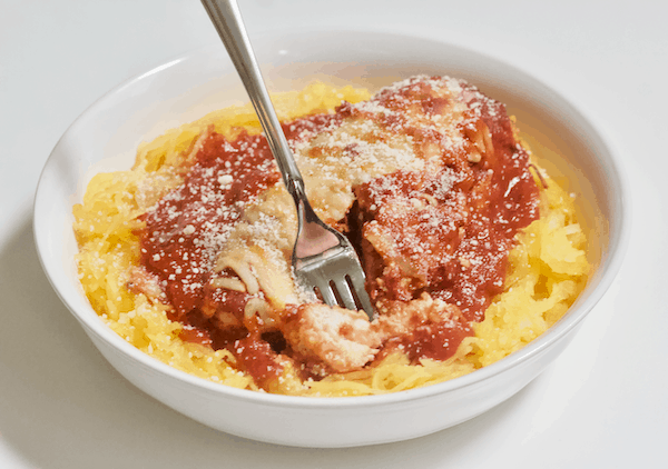 Low-Carb KETO Chicken Parmesan | A healthy, low-carb version of a favorite, classic Italian dish! This KETO Chicken Parmesan is high protein, gluten-free, and amazingly flavorful. You won't miss the grains or gluten in this healthier alternative.