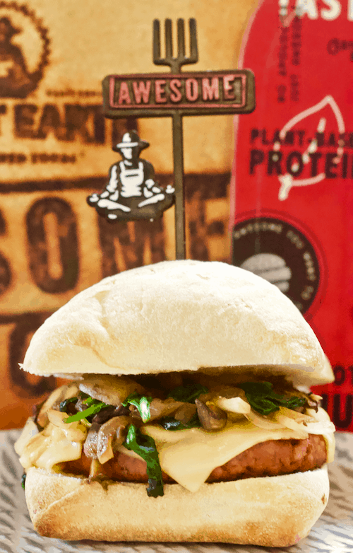 AWESOME Vegan Burger with Caramelized Onions, Mushrooms, Greens & Smoked Gouda | A STACKED plant-based burger with caramelized onions, mushrooms, greens and melted vegan smoked gouda. Made with the new AWESOME burger's from Sweet Earth. Delicious and meat-lover approved!