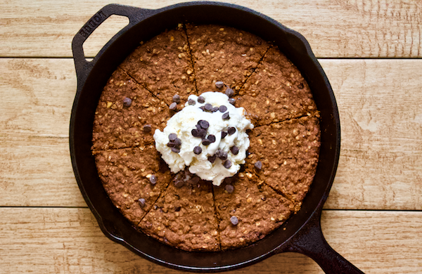 Vegan Peanut Butter Chocolate Chip Skillet Cookie Sundae | Warm peanut butter chocolate chip skillet cookie combines with cold, creamy vegan gelato for the ultimate clean treat! Gluten-free, naturally sweetened, and sure to satisfy all your dessert cravings.